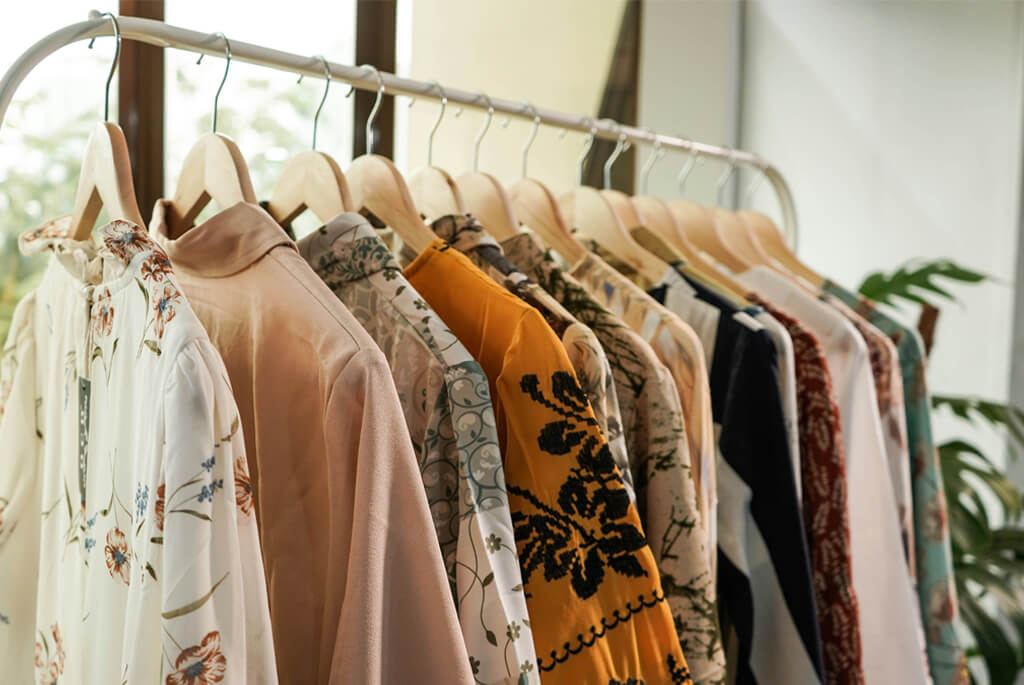 Photo of rail of vintage clothing, various styles and colours