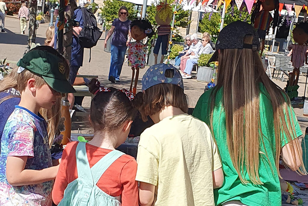 Children at an outdoor crafting session at Peak Village, Rowsley