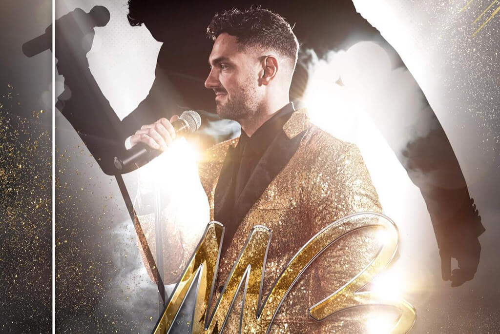 Male singer with gold suit on