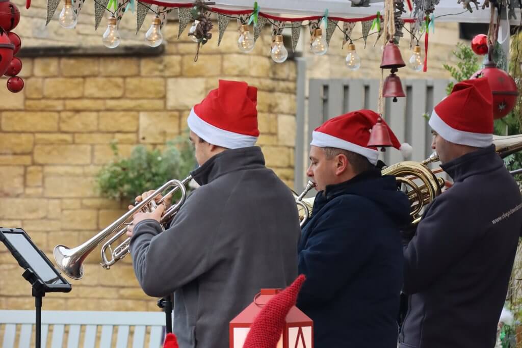 Brass band trio in Christmas hats