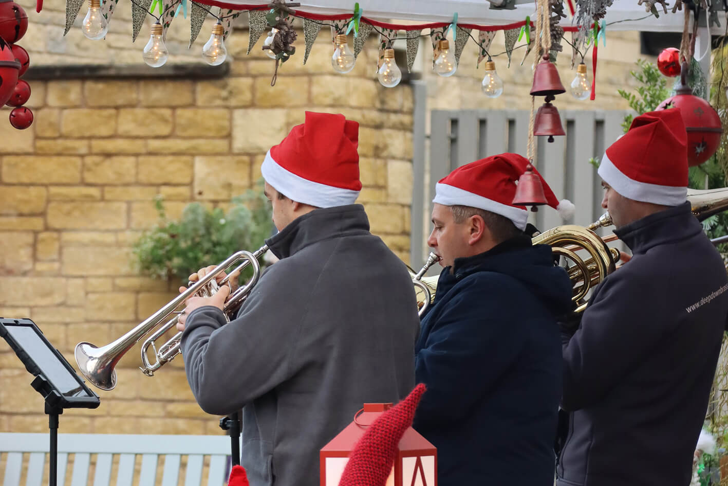 Brass band trio in Christmas hats