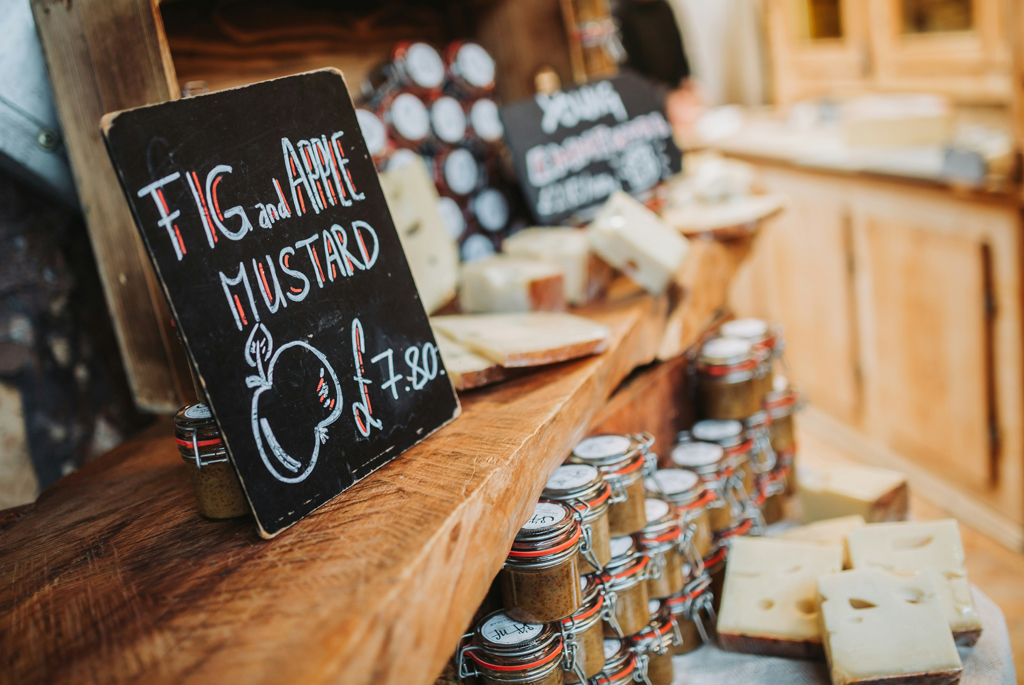 Chutney and cheese in a shop on wooden shelves